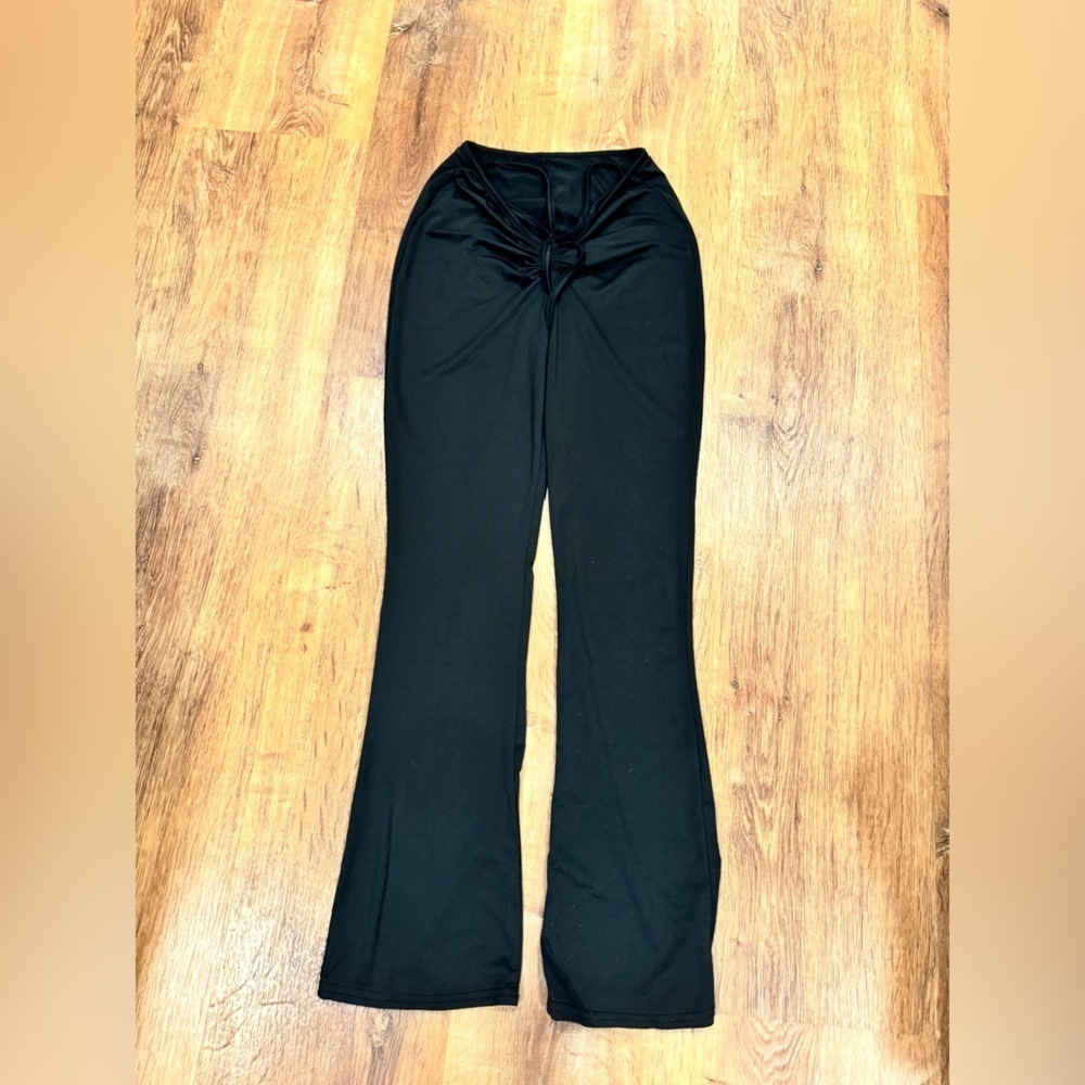 Black bootcut cinched v waist pants​​​​​